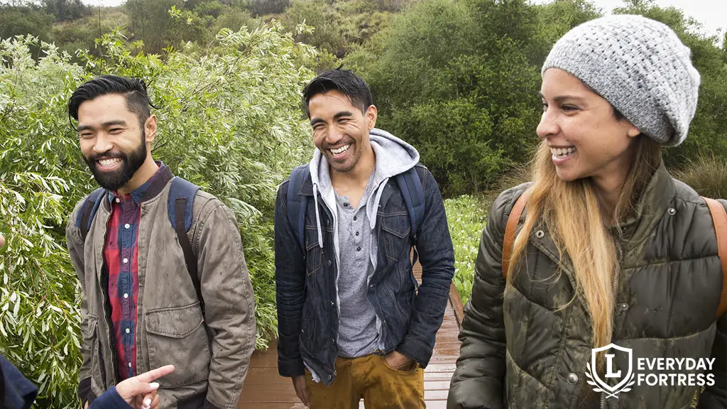 Young friends walking and smiling after making a personal loan agreement