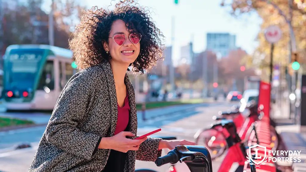 Young woman using public bikeshare, representing modern transportation options for non-drivers in the city