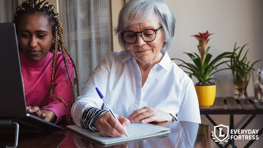 Person writing a will by hand at a desk